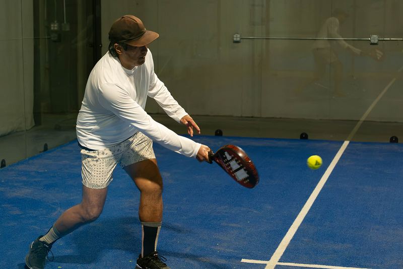 A veteran player lines up a forehand - padel is a game for every age