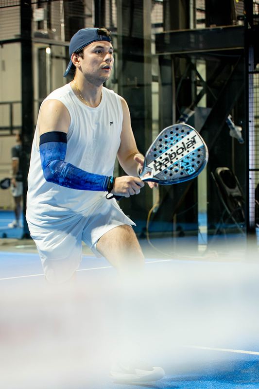 A player sets up for a volley at the net