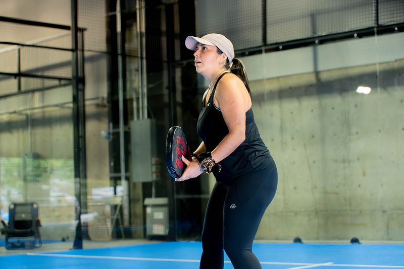 A player prepares to return serve in a doubles match